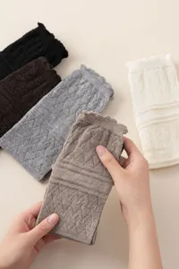 Knit lace hollow leg warmers detailed view, soft wool blend fabric, stylish winter accessory