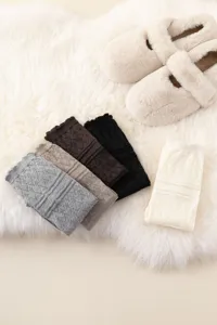 Knit leg warmers detail view showcasing ribbed hollow texture and multi-color sock options.