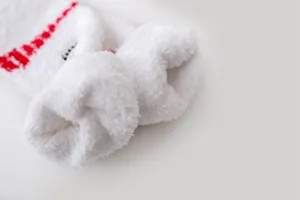 Soft white coral fleece fuzzy socks for women, warm winter sleep socks with cute details.