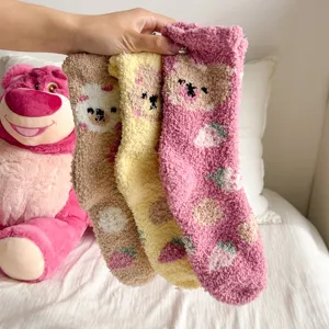 Soft fuzzy coral fleece mid-tube socks with cute cartoon bear and strawberry patterns.