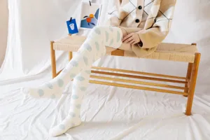 Cozy fluffy over-the-knee coral fleece socks with cute polka dot patterns for women winter.
