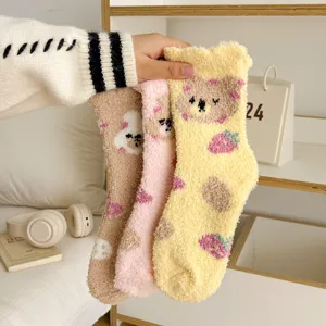 Fuzzy coral fleece winter socks detail, cute bear and strawberry pattern, cozy sleep socks.