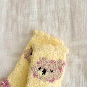 Cozy yellow coral fleece fuzzy socks for women, cute winter thick warm floor socks.