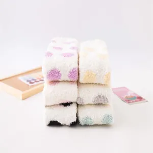Cozy polka dot coral fleece over-the-knee winter socks detail showing soft fluffy texture.
