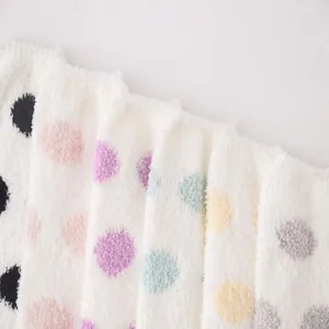 Detailed view of cozy fluffy coral fleece polka dot over-the-knee socks for women autumn winter.