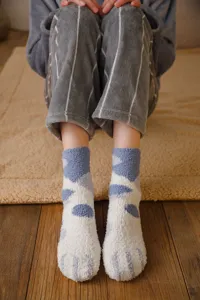 Cozy fuzzy coral fleece socks featuring cute cat paw design for warm winter home wear.