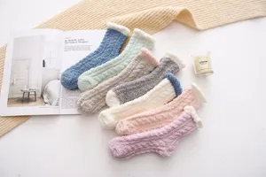 Cozy coral fleece winter socks with cable knit and fluffy cuffs displayed nicely.