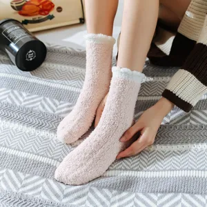 Cute winter fluffy coral fleece mid-tube socks with white lace trim for cozy indoor wear.