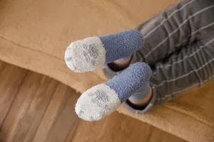 Cozy fuzzy plush socks for women, cute cat paw design, thick winter sleep socks for home use.