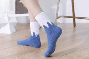 Coral fleece thickened warm mid-tube socks detail view, soft cozy fabric texture close-up.