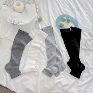 Calcetines largos con estribo para mujer calentadores de punto acanalado lisos