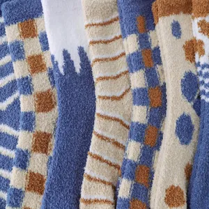 Close-up detail of cozy coral fleece winter socks with soft plush texture and cute patterns.