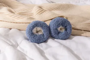 Coral fleece fluffy home sleeping socks for women, thick cozy winter floor socks detail.