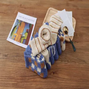 Thickened coral fleece cozy winter socks detail shot, blue checkered home floor wear design.