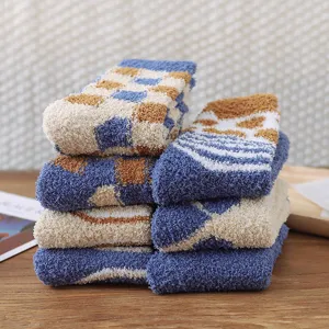 Cozy coral fleece winter socks for women, thick warm plush floor sleep socks with chic checkered design.