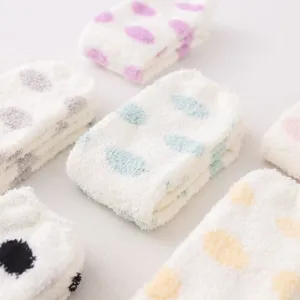 Cozy cute polka dot coral fleece knee high socks for women, soft warm winter home sleep socks.