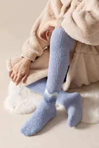 Cozy over-the-knee fleece socks for winter, thick warm plush sleep socks with wave pattern.