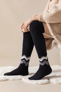 Cozy over-the-knee fleece fuzzy socks for winter warmth, soft black sleep floor socks.