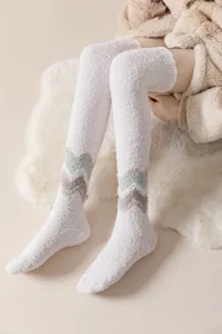 Cozy fuzzy over-the-knee fleece socks detail view, soft warm winter thermal hosiery for women.
