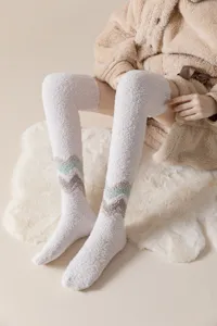Fuzzy over-the-knee thermal winter socks for women, thick cozy fleece long stockings.