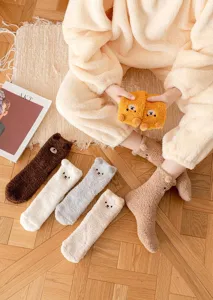 Cozy winter fuzzy socks with cute bear ears and embroidery, soft coral fleece home sleep wear.