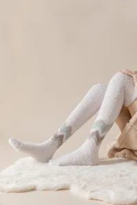 Cozy fleece over-the-knee socks for women, winter thick warm floor socks with chic chevron pattern.