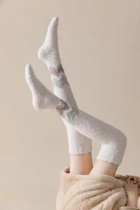 Cozy coral fleece over-the-knee winter warm fuzzy long socks for women daily home wear.