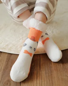 Cozy coral fleece winter socks for women, thick warm home floor socks with cute cartoon design.
