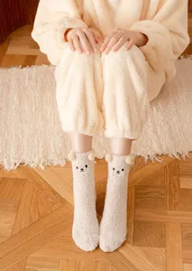 Cozy coral fleece fuzzy winter socks with cute 3D bear ears and soft plush fabric for home.