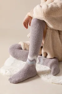 Soft fuzzy over-the-knee coral fleece socks, thick warm winter home sleep floor socks.