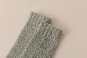 Close-up detail of soft winter warm coral fleece socks, comfortable thickened texture.