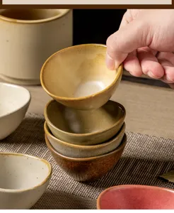 Japanese vintage ceramic small side dish detail showing textured dipping sauce bowl stack.