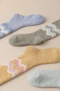 Close-up of soft fuzzy winter coral fleece thermal socks featuring cozy chevron pattern.