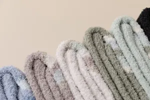 Cozy coral fleece fuzzy socks for women and men, thick winter warm sleep floor socks.
