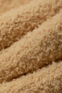 Coral fleece fabric detail close-up texture warm soft cozy winter material macro shot