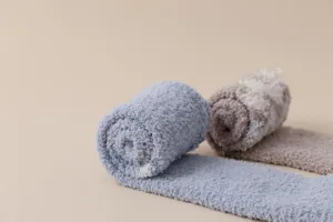 Detailed view of winter thick warm coral fleece over-the-knee socks for cozy home sleep.
