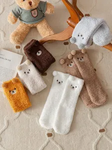 Cozy plush coral fleece winter mid tube socks featuring cute 3D bear ears for home sleep wear.