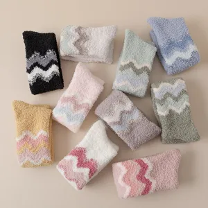 Winter warm coral fleece fuzzy socks for women, thick cozy home floor socks with cute zigzag design.