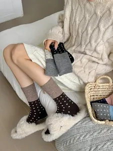 Detailed view of women winter warm polka dot wool socks, cozy Korean style mid-calf knit socks.