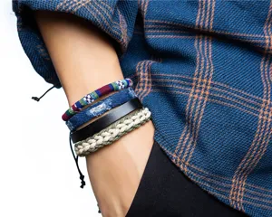 Close-up detail shot of four-piece ethnic bohemian woven leather denim bracelet set.