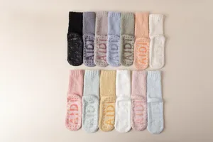 Thickened coral fleece socks with anti-slip silicone soles, cozy warm mid-tube fuzzy floor socks.