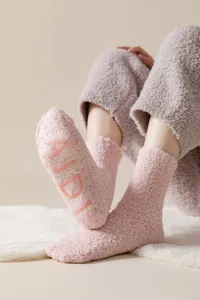 Thickened coral fleece fuzzy socks with anti-slip silicone soles for warm indoor winter wear.