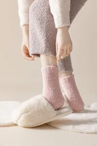 Soft thick coral fleece socks with anti-slip silicone dots for cozy indoor winter warmth.