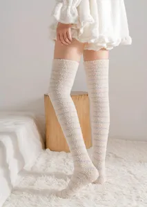 Thick coral fleece over-the-knee striped winter socks for cozy home wear and warmth.