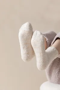 Thickened coral fleece women mid tube warm floor socks with anti slip silicone grips solid