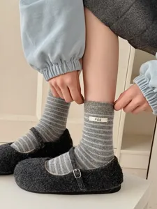 Korean style striped wool socks with egg cloth label, cozy mid-tube knit hosiery detail.