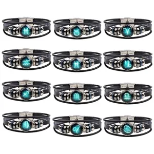 Pulsera de zodiaco de cuero multicapa vintage con cierre de acero inoxidable y dijes luminosos.