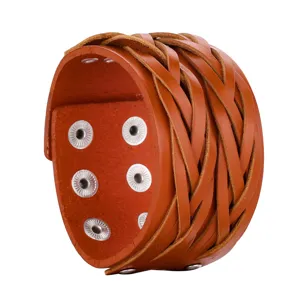 Wide braided brown leather cuff bracelet with metal snap buttons for punk retro jewelry.