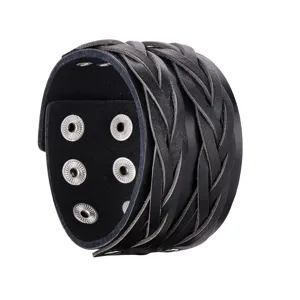 Black leather braided cuff bracelet detail, punk style wide wristband with metal snaps.