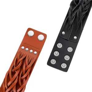 Detailed view of wide braided leather cuff bracelet with metal snaps and punk rivets.